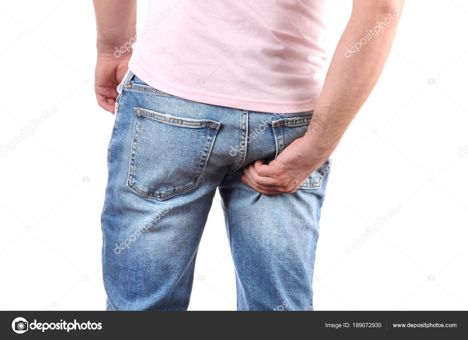 Man in jeans scratching hand his itchy ass Stock Photo by ©flisakd 189072930