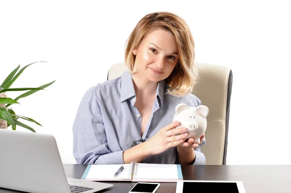 Business woman working in the office. Woman holding piggy bank — Stock Photo, Image