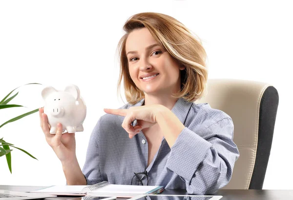 Business woman working in the office. Woman holding piggy bank — Stock Photo, Image