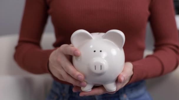 Woman Shaking Piggy Bank Financial Problem Concept — Stock Video