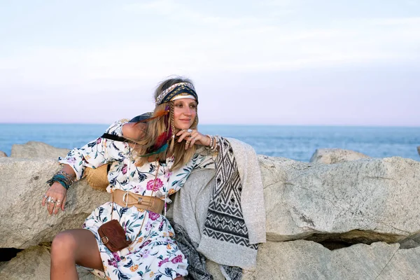 Beautiful woman wearing long dress and accessories boho style. Bohemian style girl on the beach — Stock Photo, Image