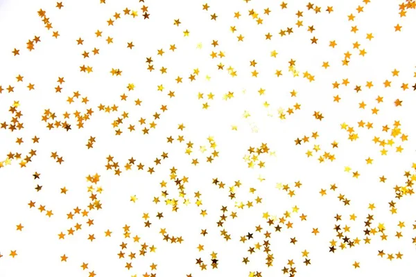 Lentejuelas doradas en forma de estrella . —  Fotos de Stock