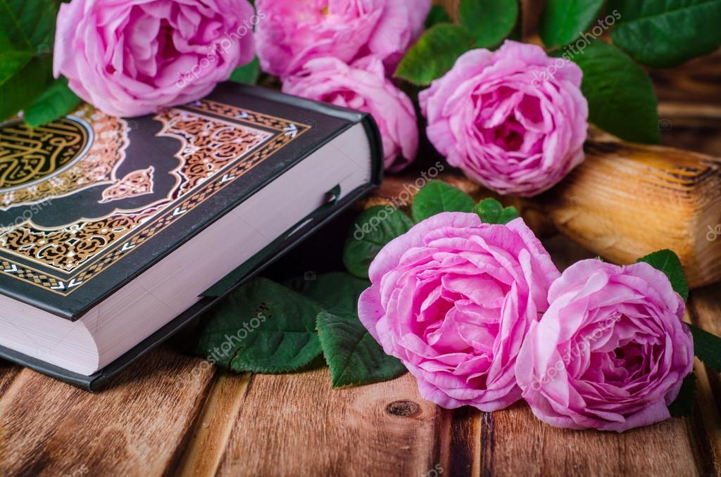 Pictures: pink quran english | Quran and pink roses on wooden