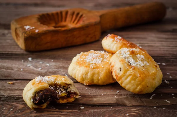 Maamoul or mamoul - arabic cookies stuffed dates with coconut near wooden mold on vintage wooden table background. Selective focus. Toned image — Stock Photo, Image