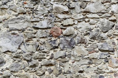 Taş duvar dokusunun soyut arkaplanı.