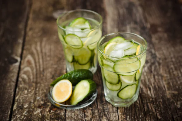 Detox water with cucumber and lemon .