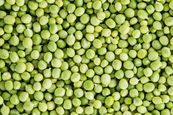 Piselli verdi sfondo, consistenza, vegetale . — Foto Stock