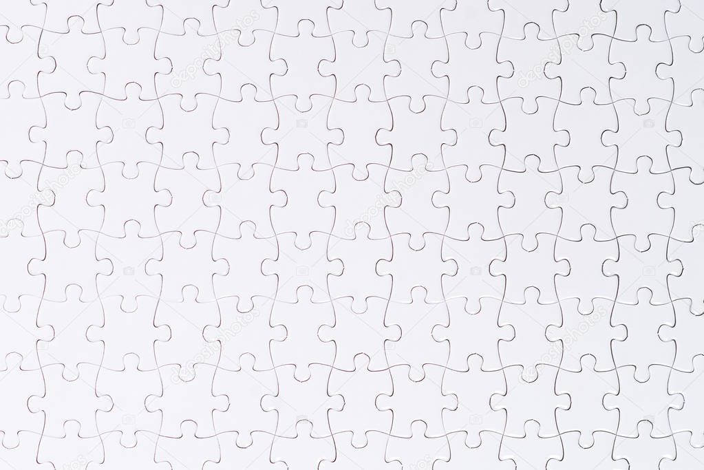 White jigsaw puzzle. Copy Space Isolated on White Background
