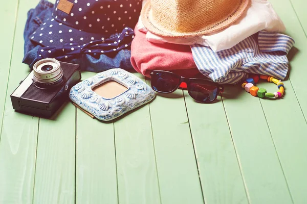 Set of kid's clothes on wooden background — Stock Photo, Image