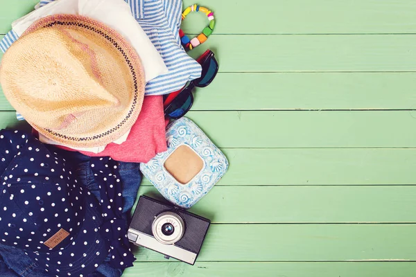 Set of kid's clothes on wooden background — Stock Photo, Image