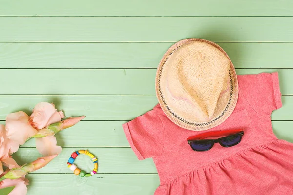 Set of baby girl's clothes on wooden background — Stock Photo, Image