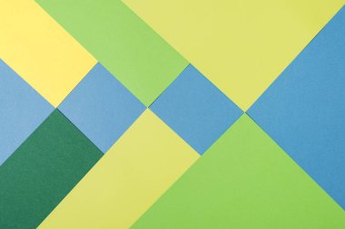 Sarı, yeşil ve mavi tonları ile kağıtları geometri düz kompozisyon arka planını renklendirin