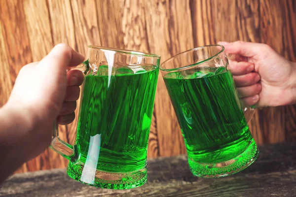 Friends toast with each other. Saint Patrick\'s day party. Group of friends is celebrating