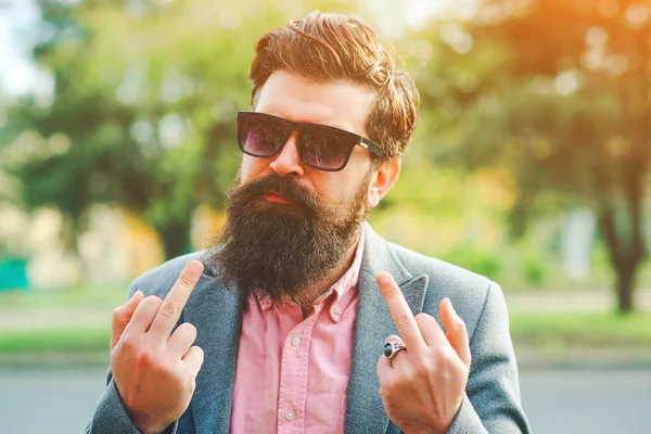 Bearded man showing fuck you. Brutal man, lifestyle. Emotions and gestures. Crazy bearded man showing the fuck sign. — ストック写真