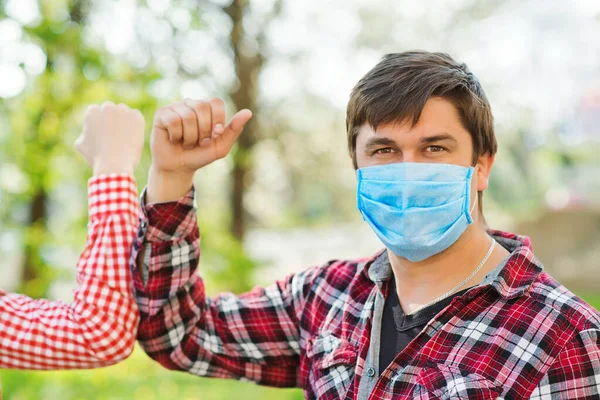 Man Wears Face Mask Outdoors Social Distancing Friends Greeting Elbows — Stock Photo, Image