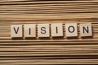 Vizyon kelime, ahşap arka plan ağaç abc küpleri.