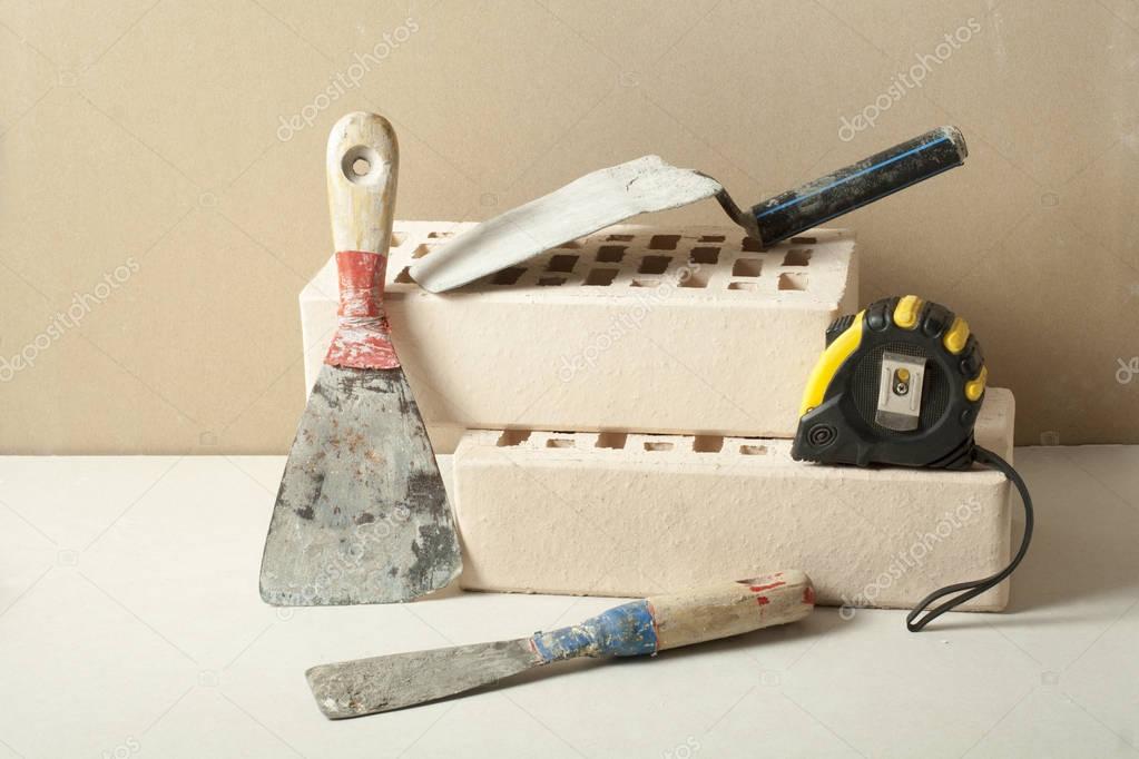 Construction tools with bricks. Free copy space. Building and renovation concept.