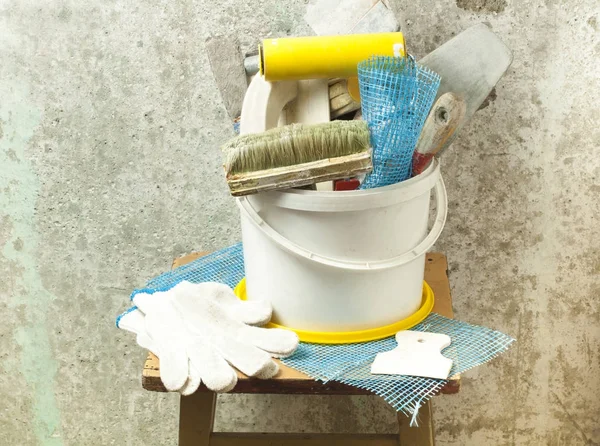 Plastic bucket with construction tools. Renovation concept. — Stock Photo, Image