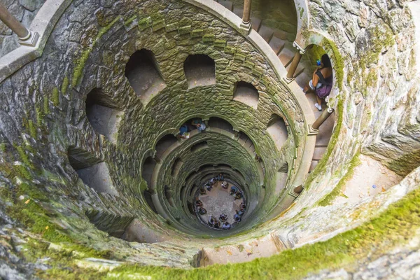 Looking down into the \'Initiation Well\' in the \'Quinta da Regaleira\' park in Sintra