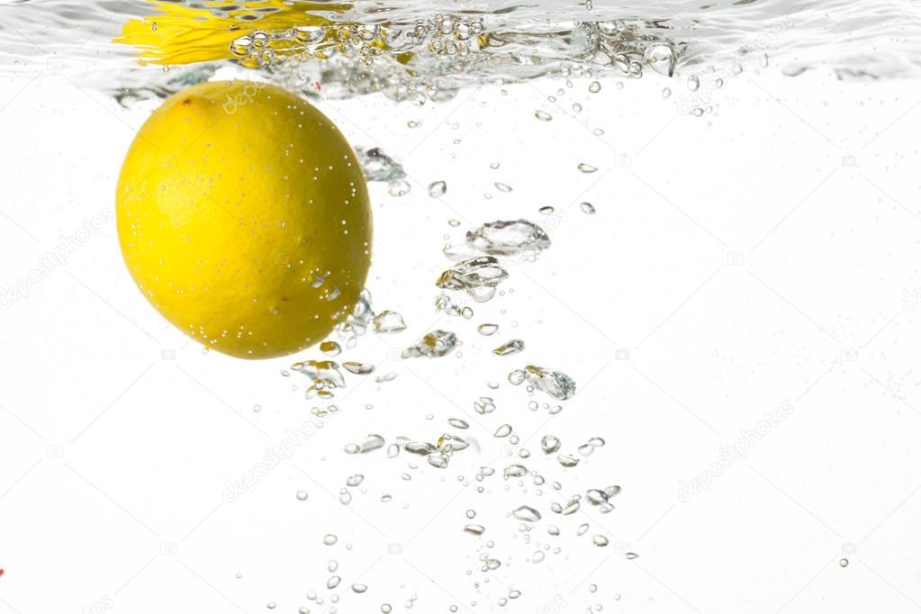 Lemon floating in water