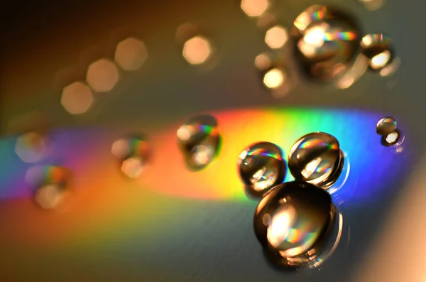 Water Drops on CD and DVD. Colorful background. — Stock Photo, Image