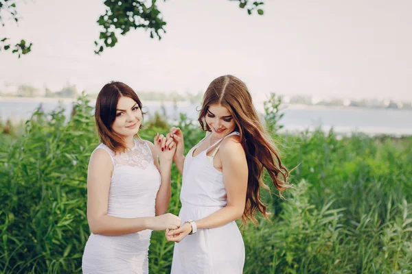 Two girls resting on the beach — Stock Photo, Image