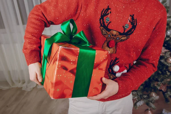 Loving couple decorating Christmas tree — Stock Photo, Image