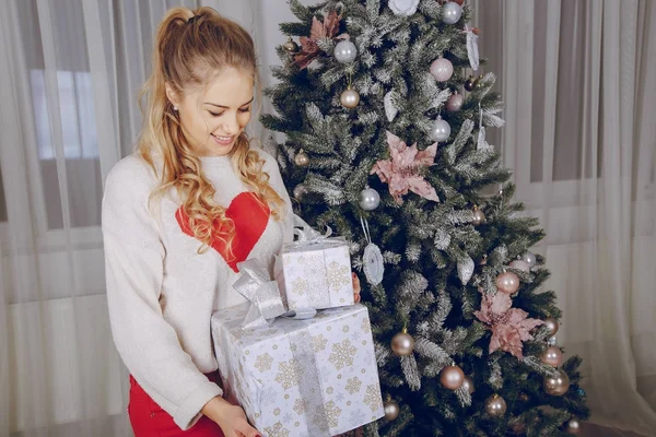 Loving couple decorating Christmas tree — Stock Photo, Image