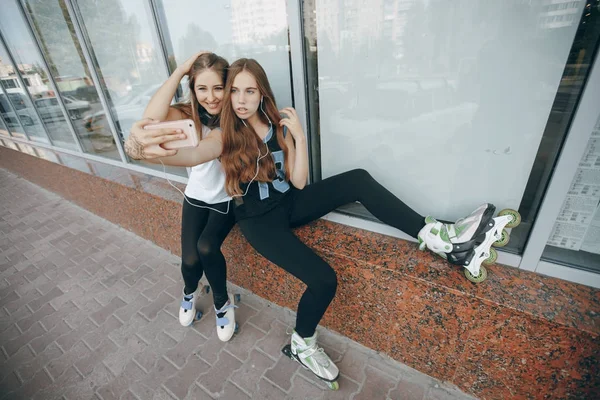 Girls with rollers — Stock Photo, Image