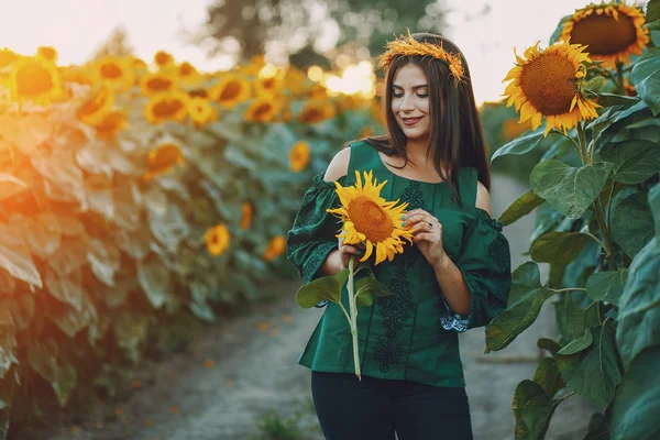 Girl and sunflowers — Stock Photo, Image