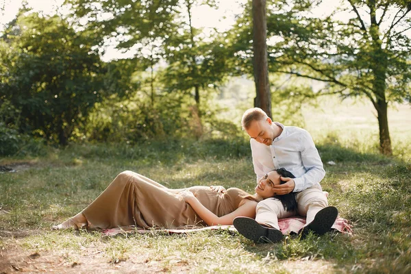 Cute family spending time in a summer field — Stock Photo, Image