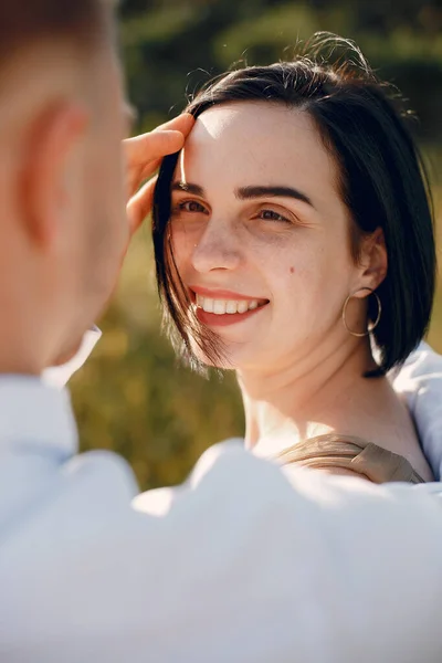 Cute family spending time in a summer field — Stock Photo, Image