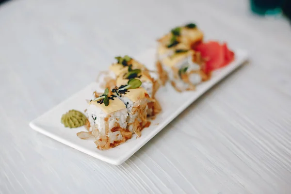 Delicious sushi di latar belakang putih di meja — Stok Foto