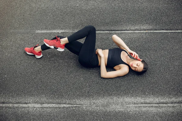 Sports girl training at the stadium — Stock Photo, Image