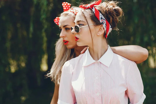 Retro girls in a park — 스톡 사진