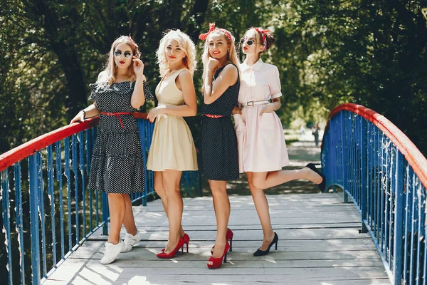 Retro girls in a park — 스톡 사진