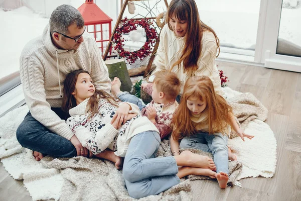 Family spending time at home in a christmas decorations — Stock Photo, Image