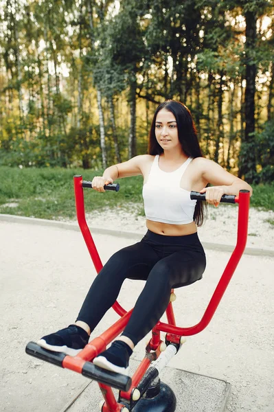 Beautiful couple training in a summer park — 스톡 사진