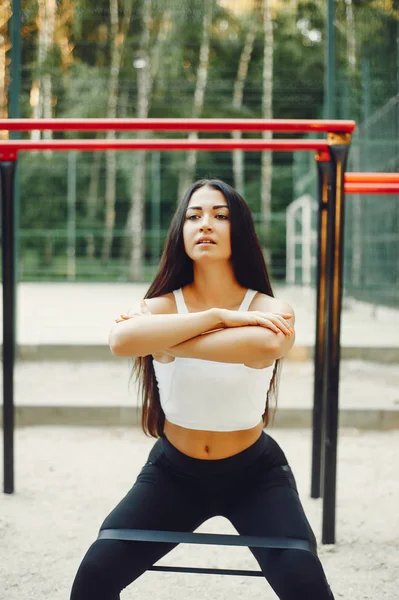 Beautiful couple training in a summer park — 스톡 사진