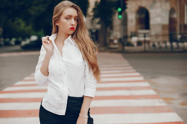 Stylish gir standing in a summer city — 스톡 사진