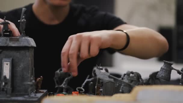 Closeup of male hands moving board game creatures — Stockvideo