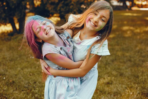 Two cute girls have fun in a summer park — Stock Photo, Image