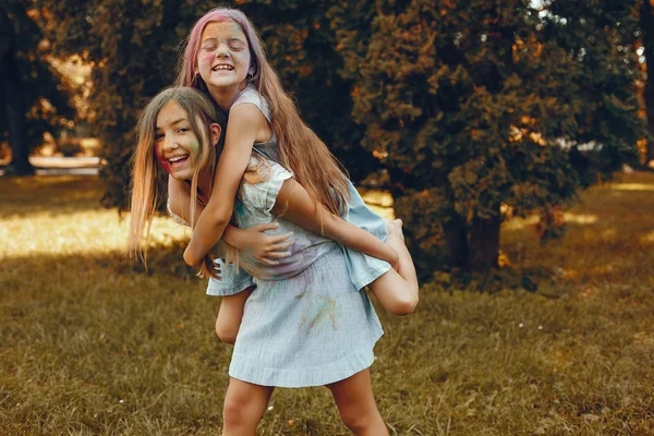 Two cute girls have fun in a summer park — Stock Photo, Image