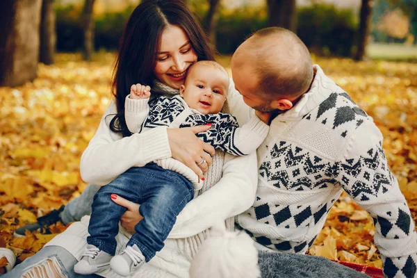 Family with son in a autumn park — Stock Photo, Image