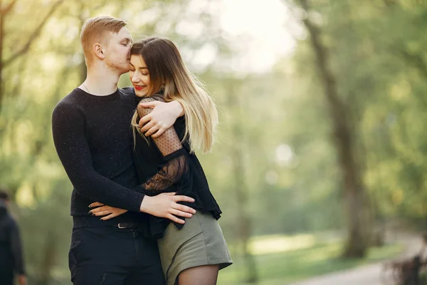 Beautiful couple spend time in a spring park