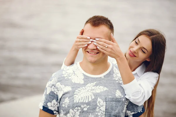 Beautiful couple spend time in a autumn cloudy park — Stock Photo, Image