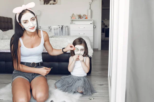 Mother and daughter doing spa treatments for the face at home