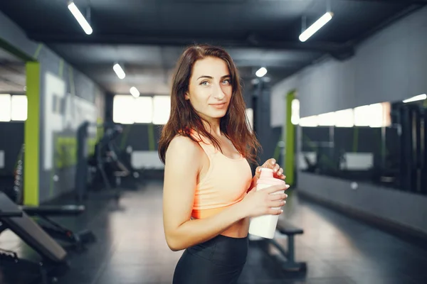 stock image Beautiful tense girl doing in the gym