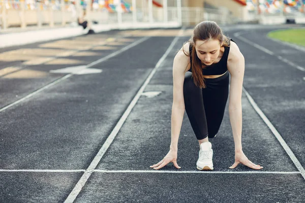 Sports girl training at the stadium — Stock Photo, Image