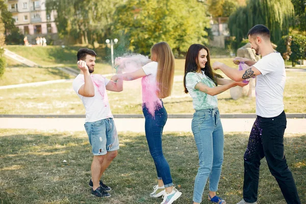 People have fun in a park with holi paints — ストック写真